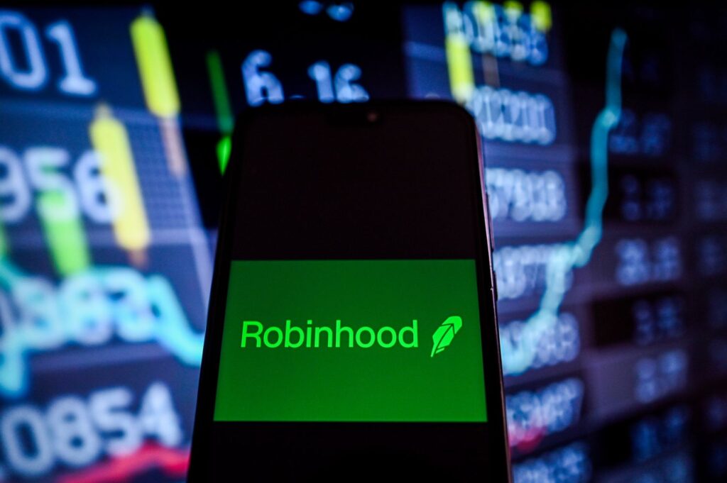 Robinhood mobile app interface showing how to buy Figma stock (FIG) with buy button and current stock price